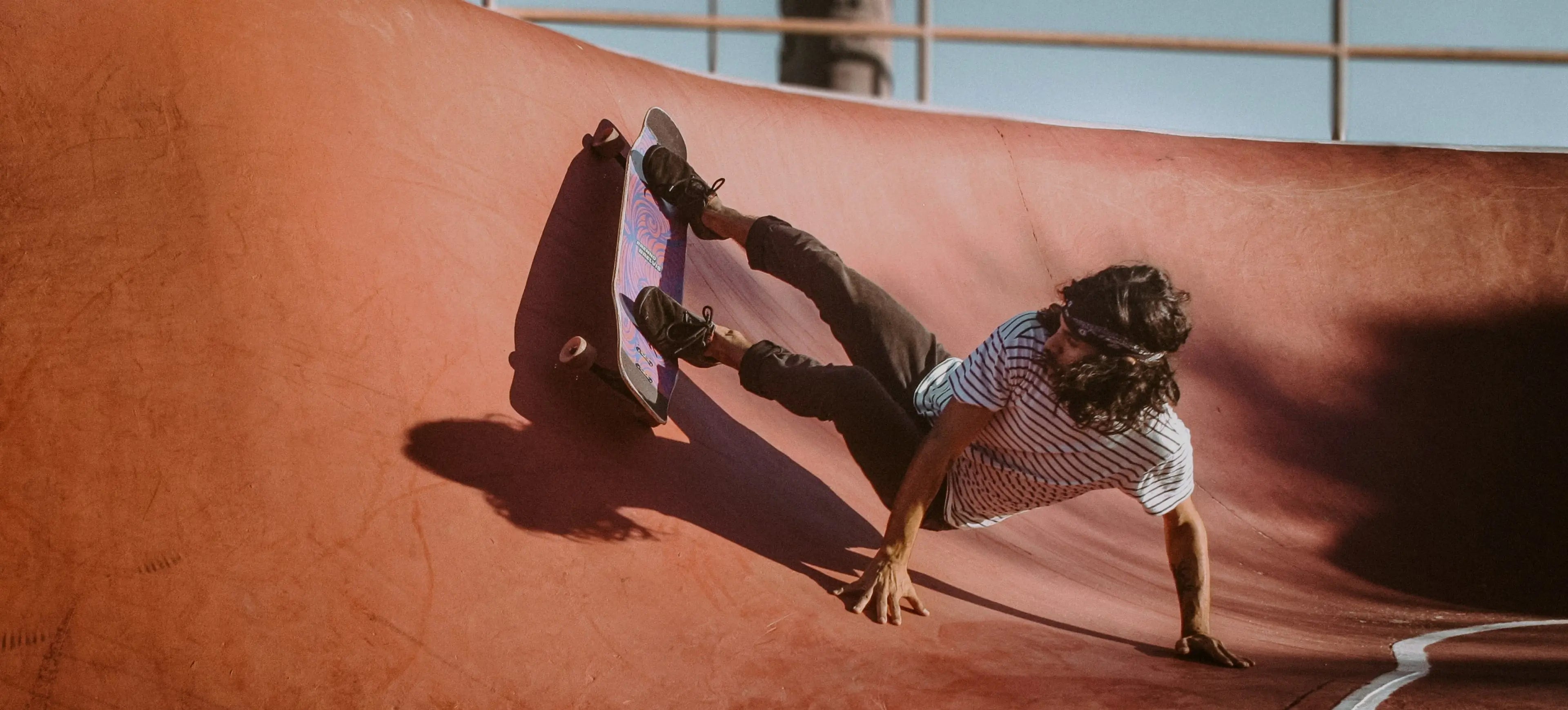 A young boy skating with ghettoblaserwear skateboardslider_item_qGqb33